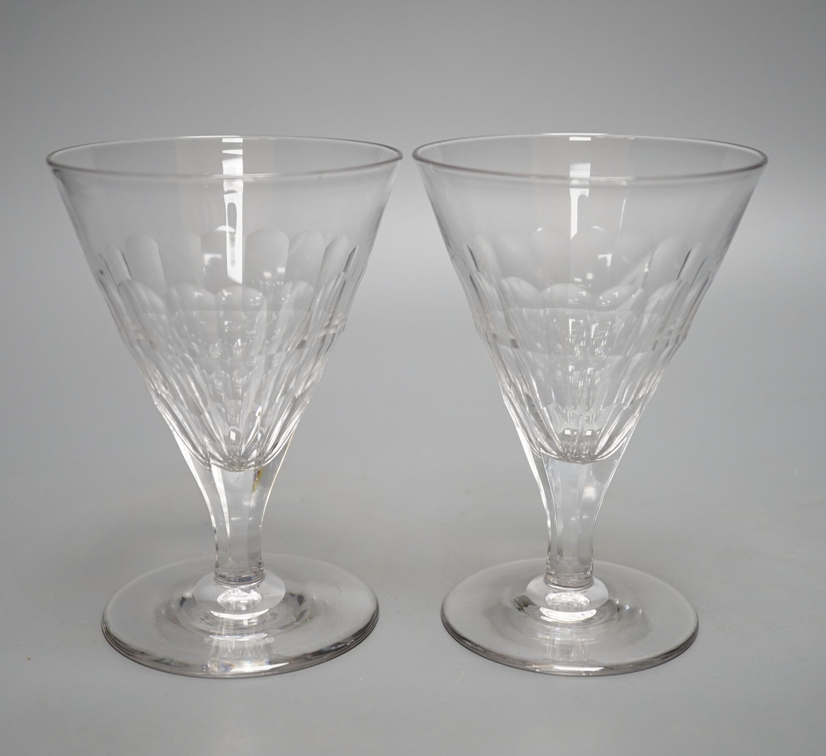 A set of ten facet cut conical wine glasses, 14cm